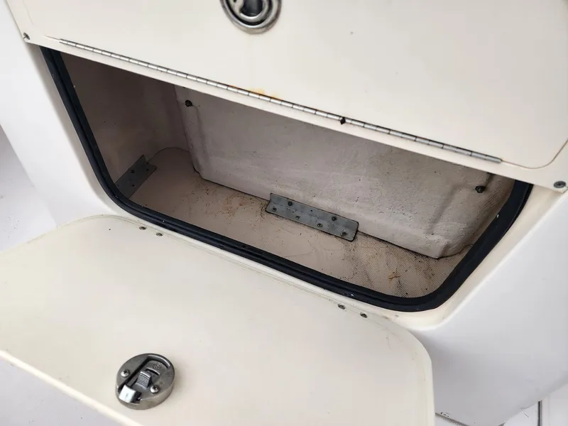 Slide: The Image of Open storage compartment on 2008 Grady-White Advance 257 boat. - 13