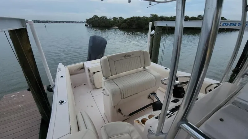 Slide: The Image of 2008 Grady-White Advance 257 boat interior at dock, overlooking calm water. - 2