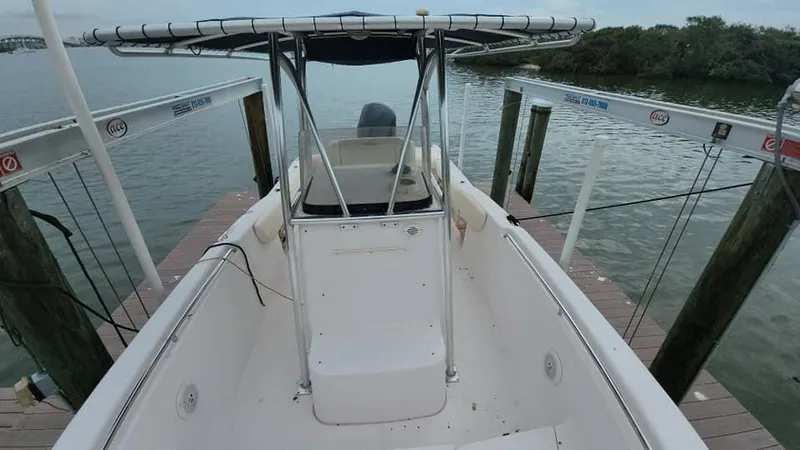 Slide: The Image of 2008 Grady-White Advance 257 boat docked by the water. - 22