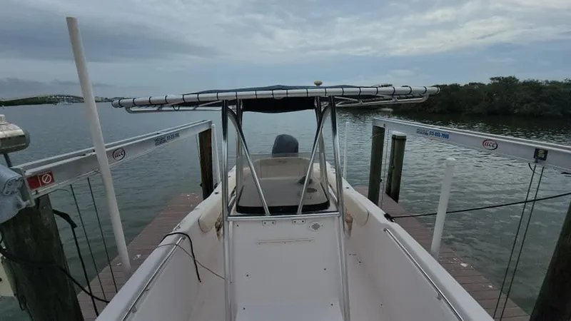 Slide: The Image of 2008 Grady-White Advance 257 boat docked by the water. - 23