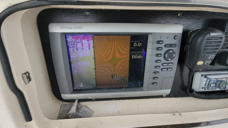 Slide: The Image of Garmin GPSmap 440s on 2008 Grady-White Advance 257 boat dashboard. - 24