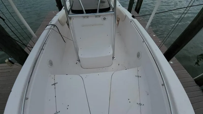 Slide: The Image of 2008 Grady-White Advance 257 boat interior, docked, showing spacious deck and seating area. - 29