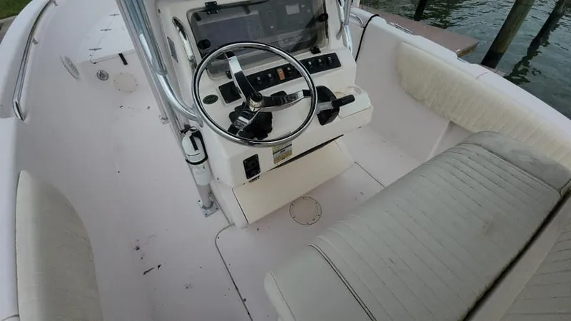 Slide: The Image of 2008 Grady-White Advance 257 boat interior with steering console and seating. - 30