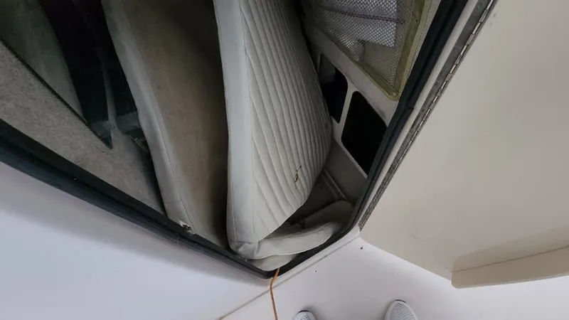 Slide: The Image of Interior view of 2008 Grady-White Advance 257 boat with cushioned seating. - 34