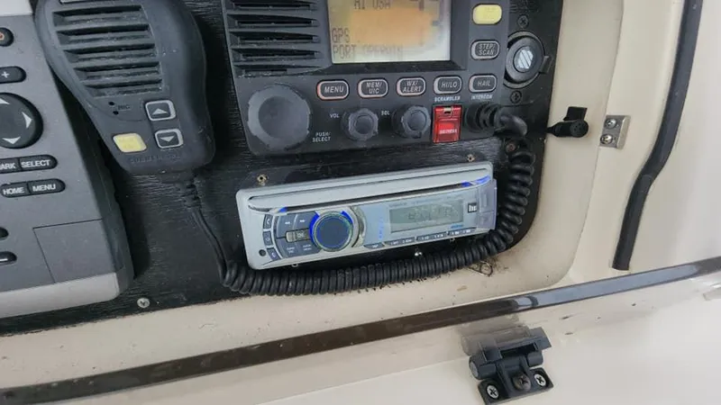 Slide: The Image of Boat dashboard with radio and control panel on 2008 Grady-White Advance 257. - 36