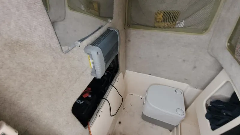 Slide: The Image of Interior of 2008 Grady-White Advance 257 boat with portable toilet and battery compartment. - 37