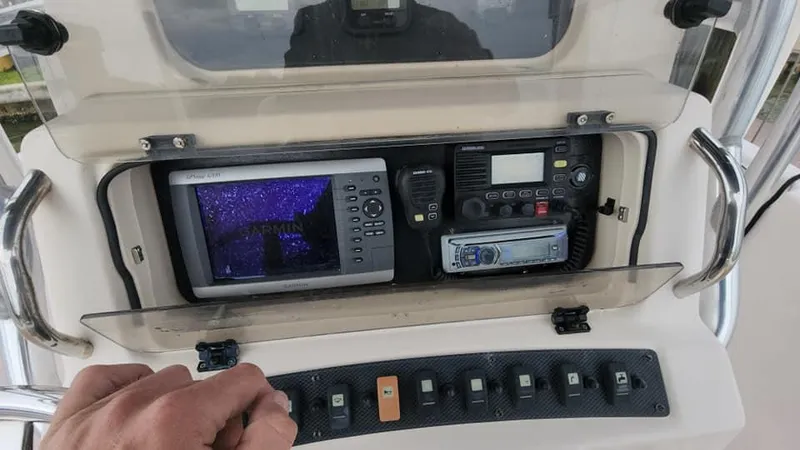 Slide: The Image of Control panel of 2008 Grady-White Advance 257 boat with navigation equipment. - 44