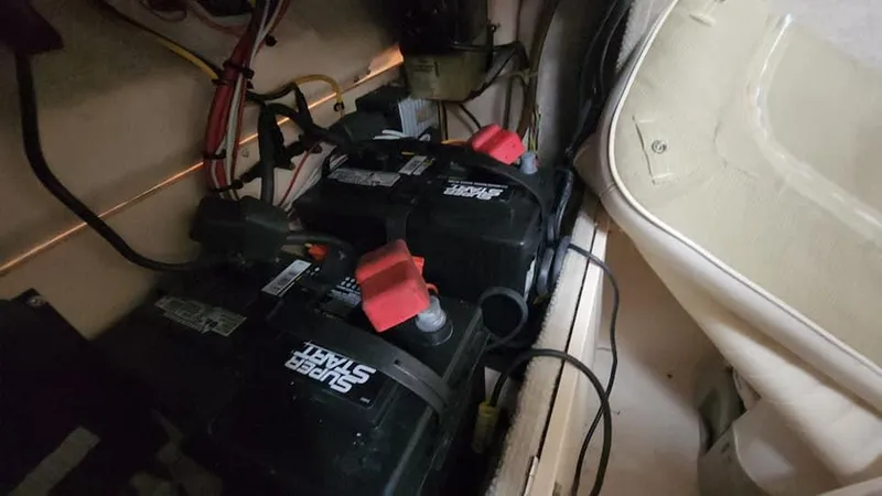 Slide: The Image of Batteries inside a 2008 Grady-White Advance 257 boat compartment. - 46