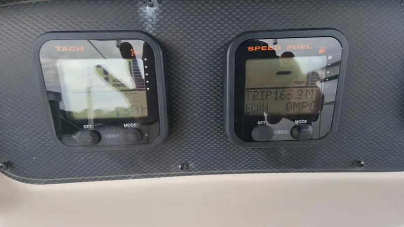 Slide: The Image of Close-up of 2008 Grady-White Advance 257 boat dashboard instruments. - 5