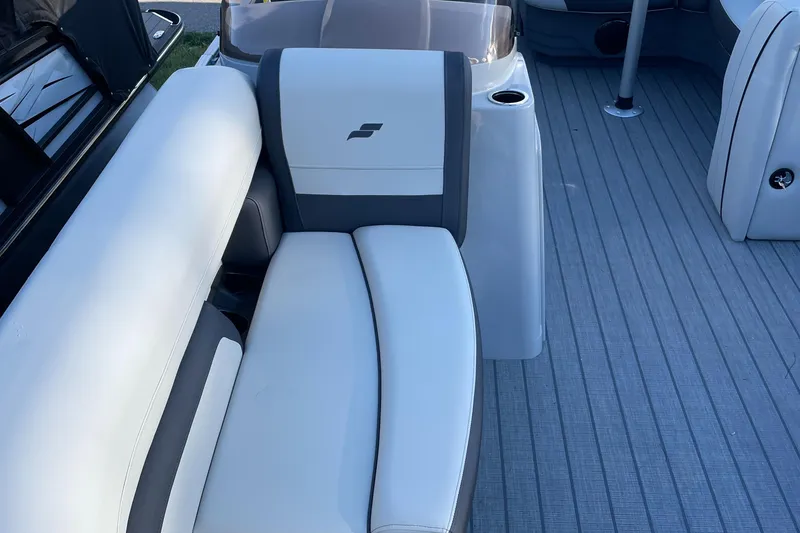 Slide: The Image of 2025 Starcraft EX 20 C boat interior with white and gray seating. - 14