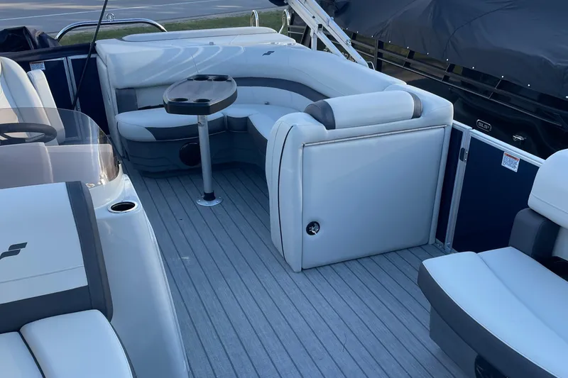 Slide: The Image of 2025 Starcraft EX 20 C boat interior with gray seating and table. - 15