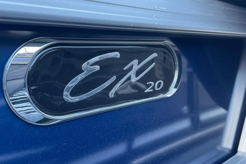 Slide: The Image of Starcraft EX 20 C 2025 model emblem on blue surface. - 16