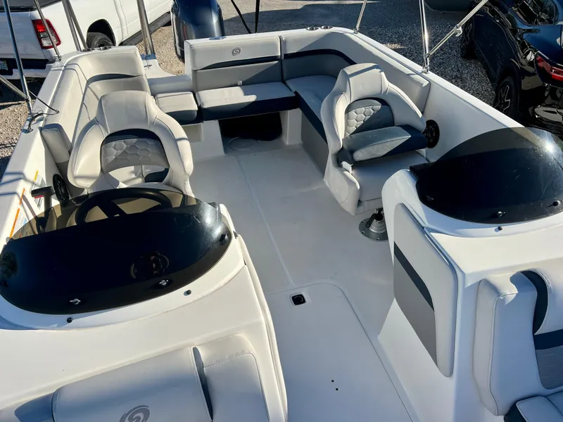 Slide: The Image of 2023 Hurricane 218 SS boat interior with seating and steering console. - 18