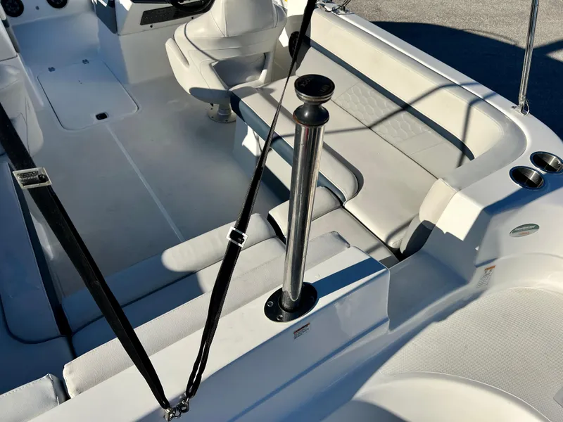 Slide: The Image of 2023 Hurricane 218 SS boat interior with white seating and cup holders. - 22