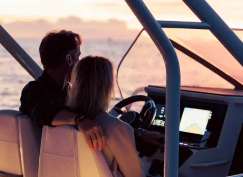 Slide: The Image of Couple enjoying sunset on 2025 Axopar AX/E 25 boat. - 5