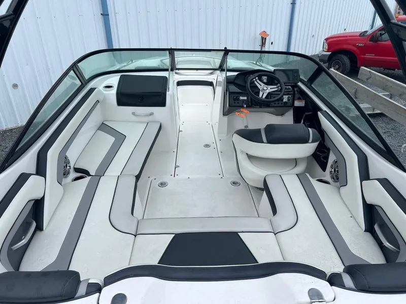 Slide: The Image of 2017 Yamaha AR195 boat interior with sleek seating and modern dashboard. - 3