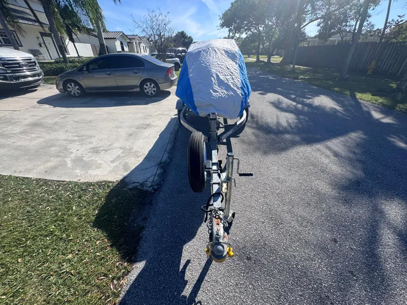 Slide: The Image of 2014 Yamaha WaveRunner VX Cruiser on trailer, covered, parked in residential driveway. - 14
