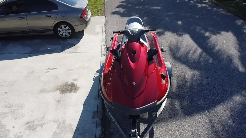 Slide: The Image of Red 2014 Yamaha WaveRunner VX Cruiser parked on driveway. - 3