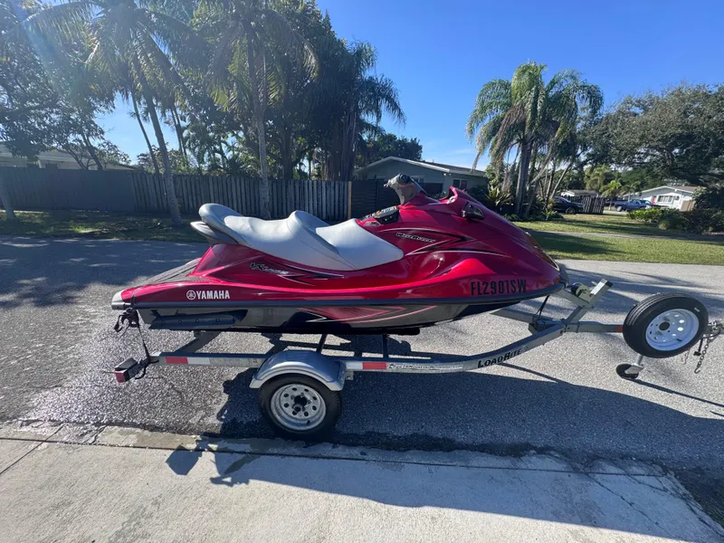 Slide: The Image of 2014 Yamaha WaveRunner VX Cruiser on trailer, parked outdoors with palm trees in background. - 7