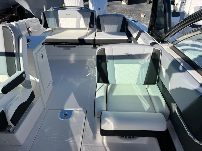 Slide: The Image of 2025 Chaparral 310 OSX boat interior with modern seating and sleek design. - 18