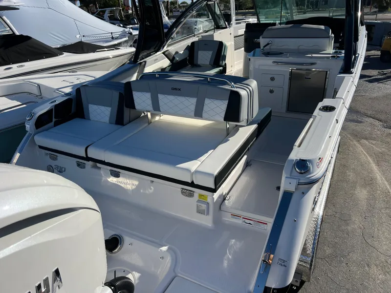 Slide: The Image of 2025 Chaparral 310 OSX boat interior with seating and helm station. - 4