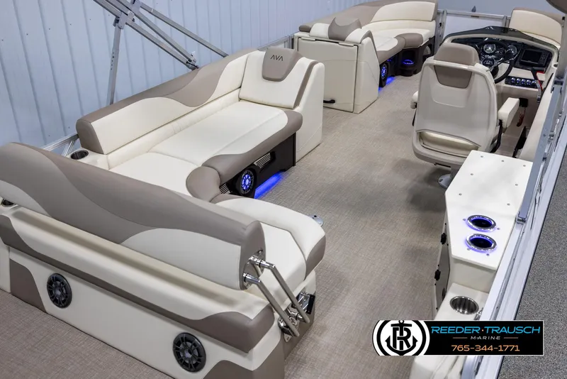Slide: The Image of Luxurious 2025 Avalon LSZ CRB pontoon boat interior with plush seating and modern dashboard. - 12