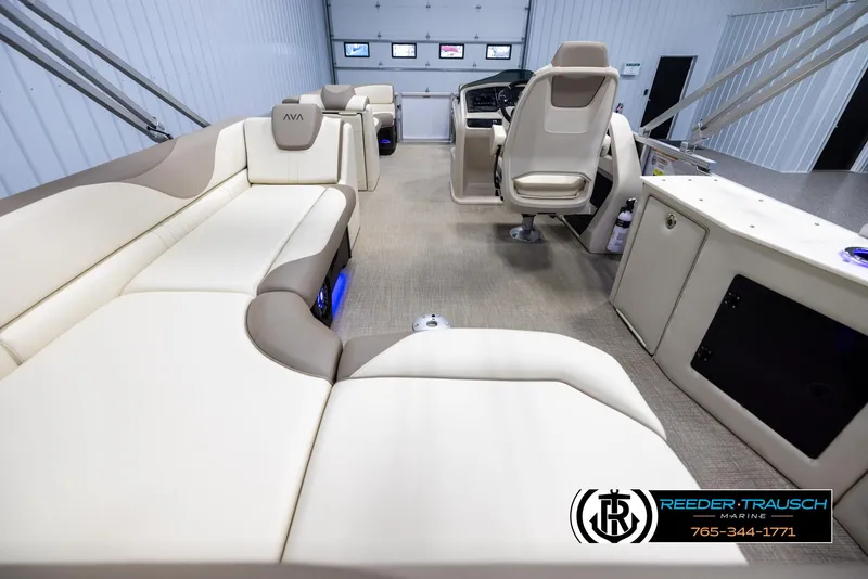 Slide: The Image of Luxurious interior of 2025 Avalon LSZ CRB pontoon boat with plush seating and modern helm. - 16