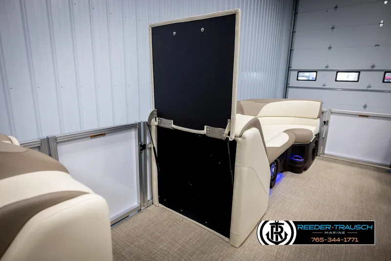 Slide: The Image of 2025 Avalon LSZ CRB pontoon boat interior with beige seating and modern design. - 21