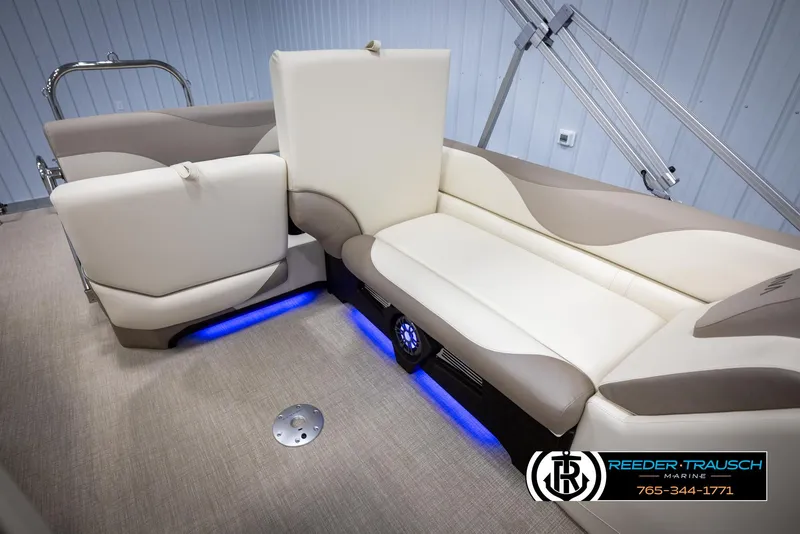 Slide: The Image of Luxurious 2025 Avalon LSZ CRB boat interior with beige seating and blue LED lighting. - 28