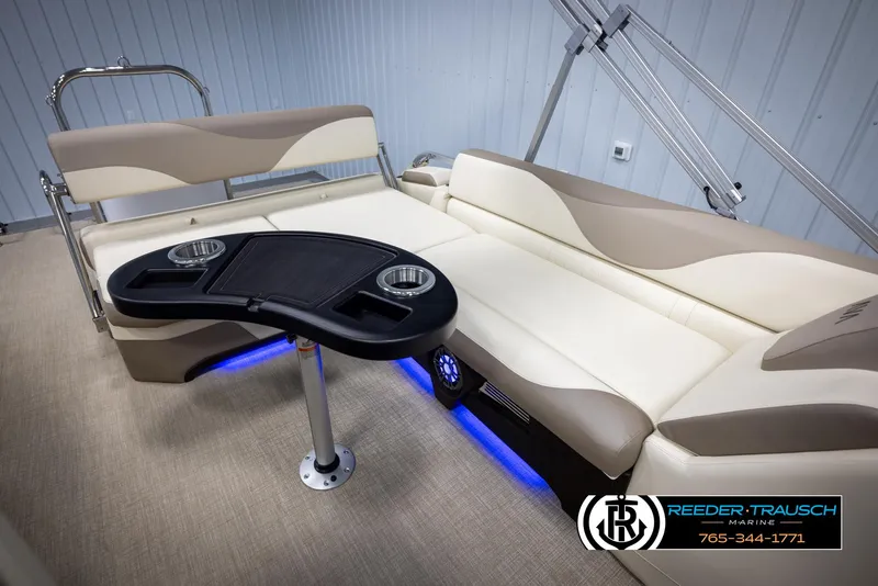 Slide: The Image of Luxurious 2025 Avalon LSZ CRB boat interior with beige seating and modern table. - 29