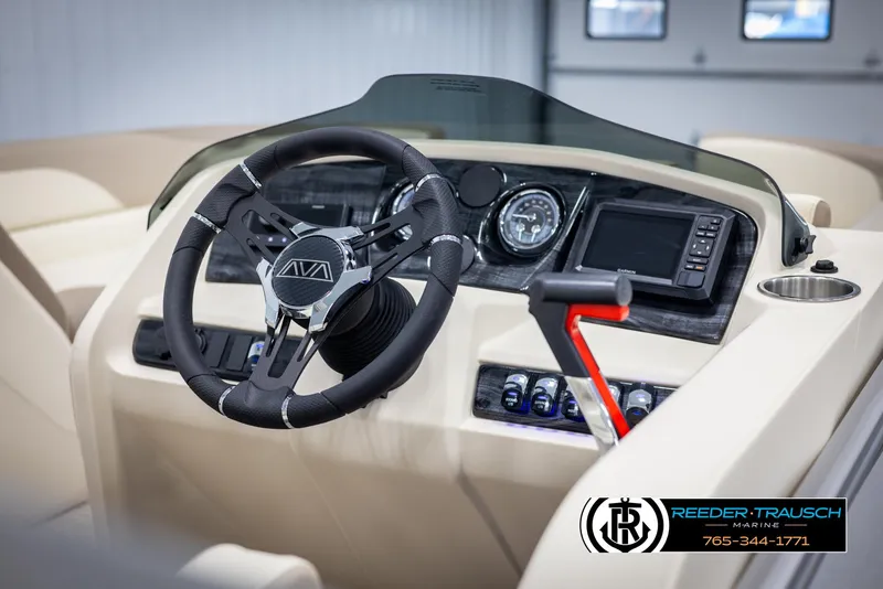 Slide: The Image of 2025 Avalon LSZ CRB boat dashboard with steering wheel, gauges, and navigation system. - 30