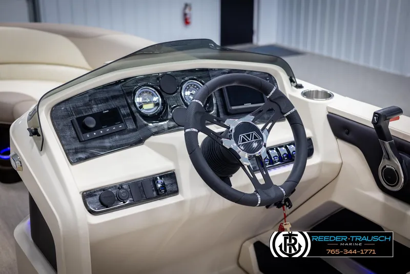 Slide: The Image of 2025 Avalon LSZ CRB boat dashboard with steering wheel and control panel. - 31