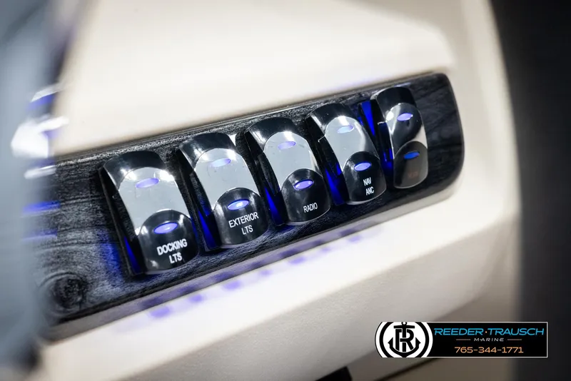 Slide: The Image of Control panel of 2025 Avalon LSZ CRB boat with illuminated switches. - 37