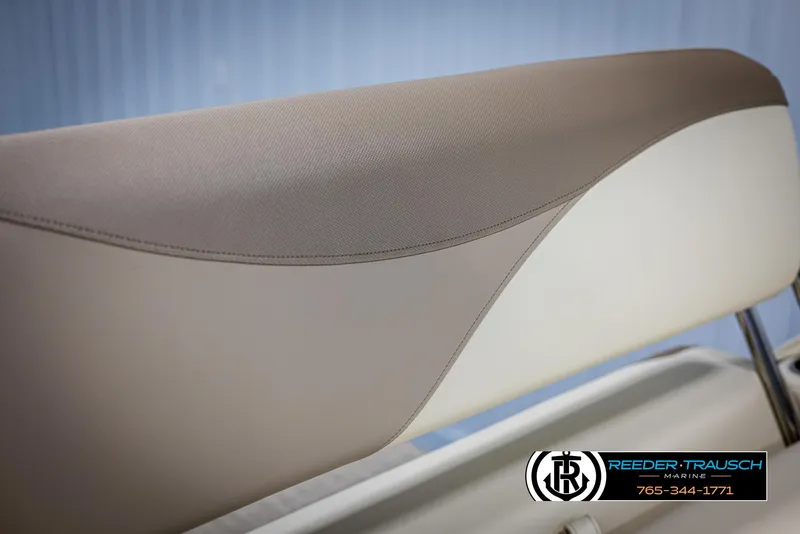 Slide: The Image of 2025 Avalon LSZ CRB boat seat with beige and cream upholstery, Reeder-Trausch Marine logo. - 40