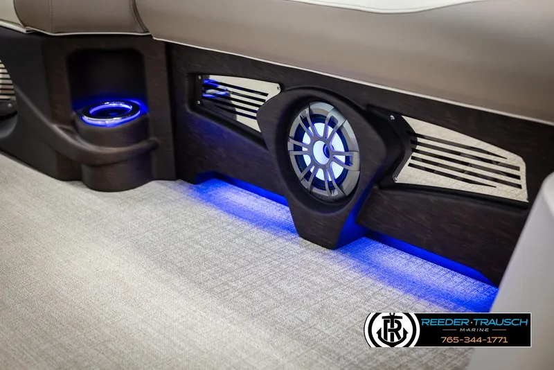 Slide: The Image of 2025 Avalon LSZ CRB interior with illuminated speaker and cup holder, featuring blue LED lighting. - 42
