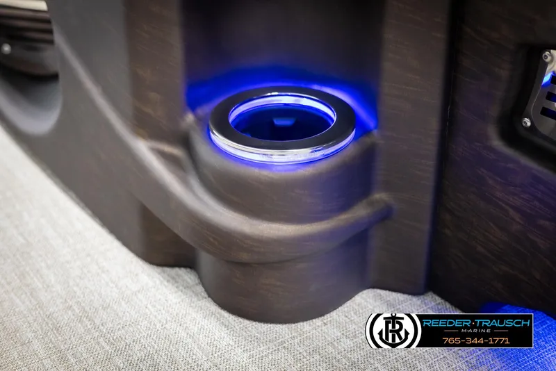 Slide: The Image of Illuminated cup holder in 2025 Avalon LSZ CRB boat interior, featuring blue LED lighting. - 44