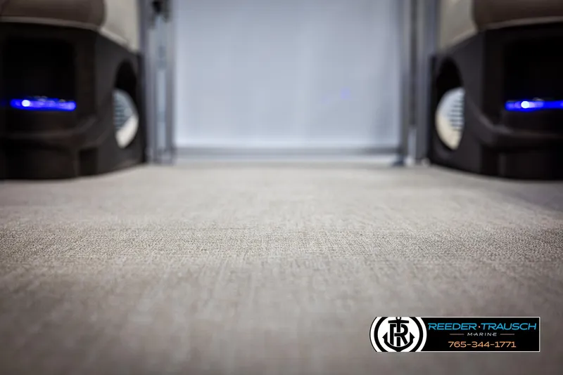 Slide: The Image of 2025 Avalon LSZ CRB interior with carpet flooring and ambient blue lighting. - 47