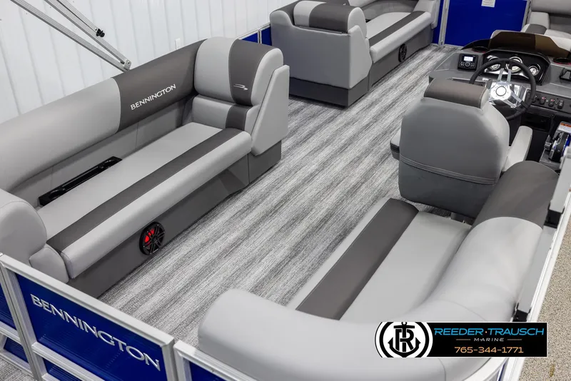 Slide: The Image of 2025 Bennington 21 SSRSE pontoon boat interior with gray seating and modern design. - 11
