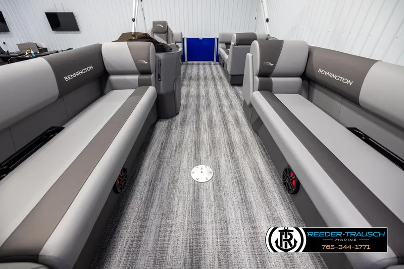 Slide: The Image of 2025 Bennington 21 SSRSE pontoon boat interior with gray seating and carpet. - 12