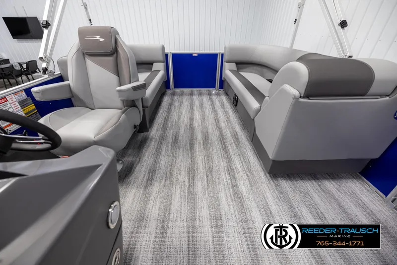 Slide: The Image of Interior of 2025 Bennington 21 SSRSE pontoon boat with gray seating and flooring. - 13