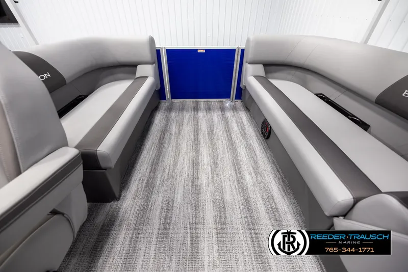 Slide: The Image of 2025 Bennington 21 SSRSE boat interior with gray seating and carpet flooring. - 14
