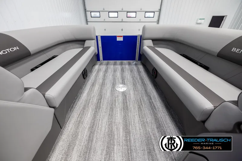 Slide: The Image of 2025 Bennington 21 SSRSE interior with gray seating and carpet flooring. - 17