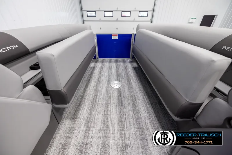 Slide: The Image of 2025 Bennington 21 SSRSE interior with gray seating and carpet flooring. - 18