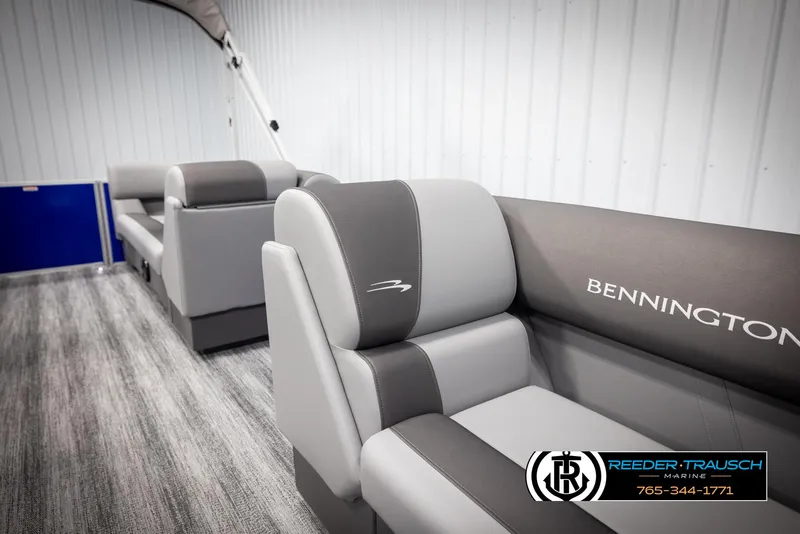 Slide: The Image of 2025 Bennington 21 SSRSE boat interior with gray seating and logo. - 20