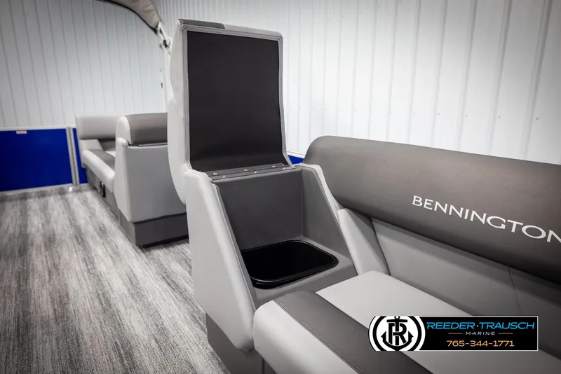 Slide: The Image of 2025 Bennington 21 SSRSE boat interior with open storage compartment and seating. - 21