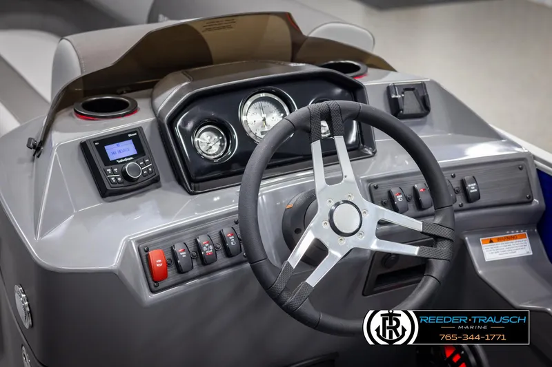 Slide: The Image of 2025 Bennington 21 SSRSE boat dashboard with steering wheel and control panel. - 23