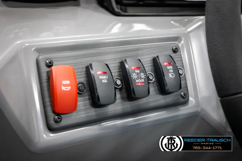 Slide: The Image of Control panel of 2025 Bennington 21 SSRSE boat with switches and horn button. - 25