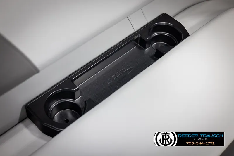 Slide: The Image of 2025 Bennington 21 SSRSE boat cup holders on sleek white seating. - 33