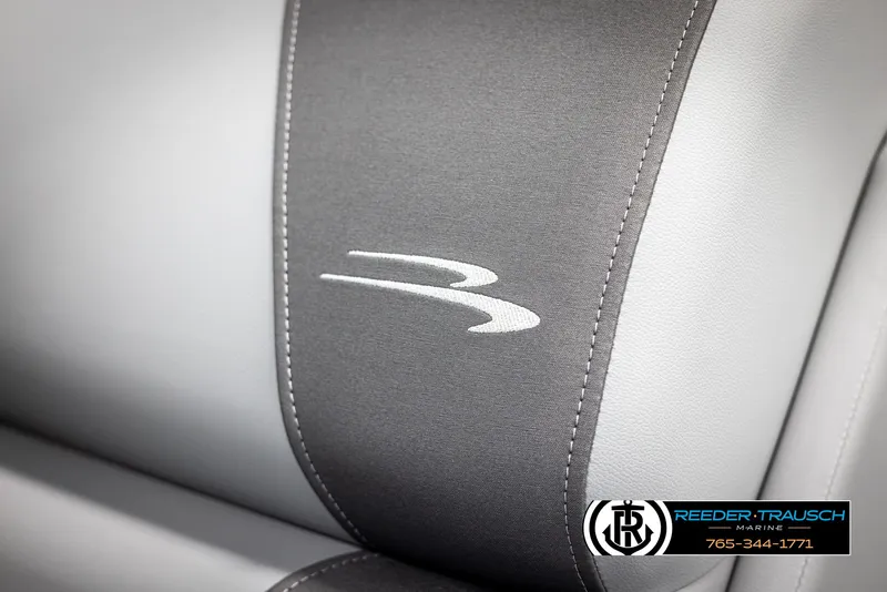 Slide: The Image of 2025 Bennington 21 SSRSE boat seat with logo, featuring gray and white upholstery. - 34