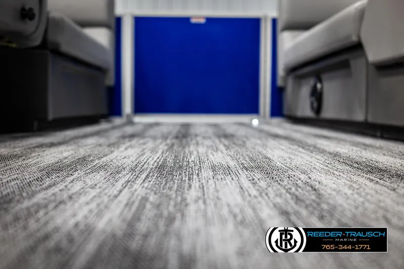 Slide: The Image of Interior view of 2025 Bennington 21 SSRSE pontoon boat with textured flooring. - 38